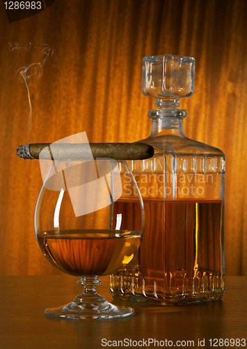 Image of Glass of whisky with cigar