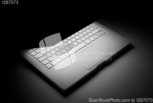 Image of laptop with the shone display