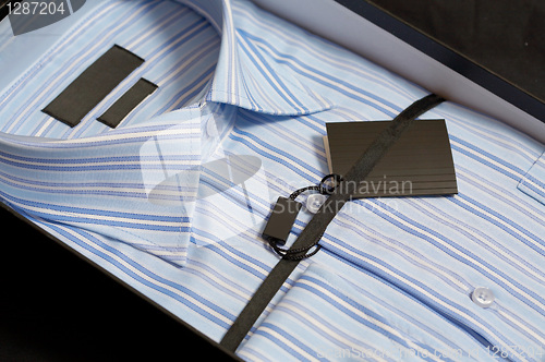 Image of New man's shirt of blue colour in a gift box