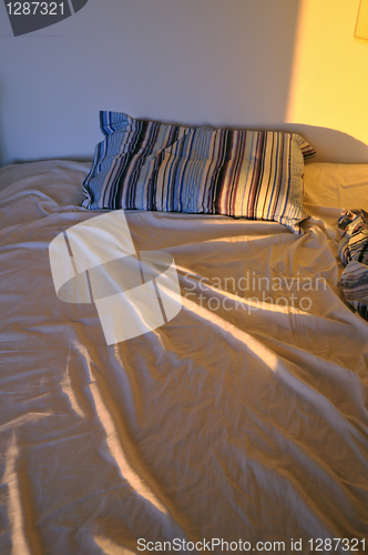 Image of unmade bed