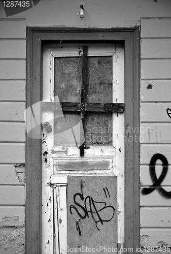 Image of boarded-up door