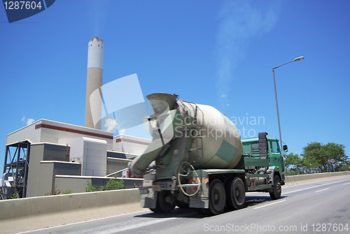 Image of coal fired power station and car moving