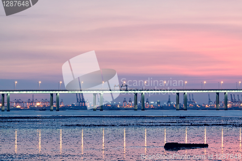 Image of sunset in hongkong and highway bridge and container pier