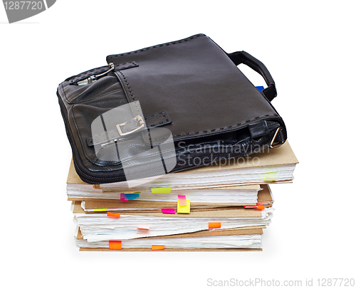 Image of Leather portfolio lying on account books