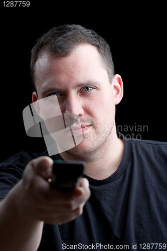 Image of Man Flippling TV Channels with the Remote