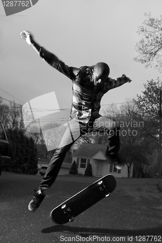 Image of Skateboarder Doing Tricks