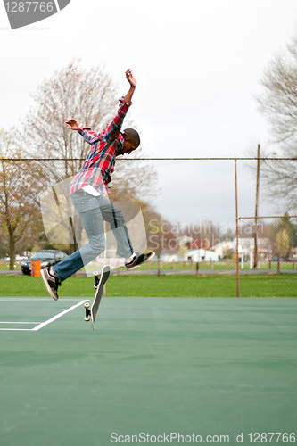 Image of Skateboarder Performing Tricks