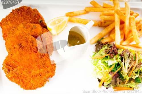 Image of classic Milanese veal cutlets and vegetables