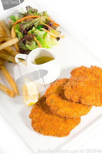 Image of classic Milanese veal cutlets and vegetables