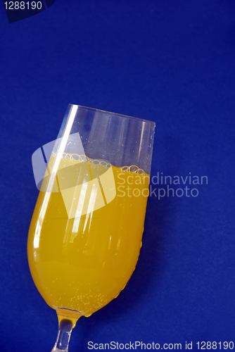 Image of Yellow drink over blue