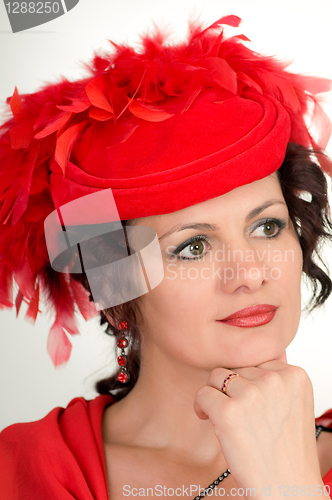 Image of woman is in red hat