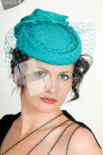 Image of woman in green hat