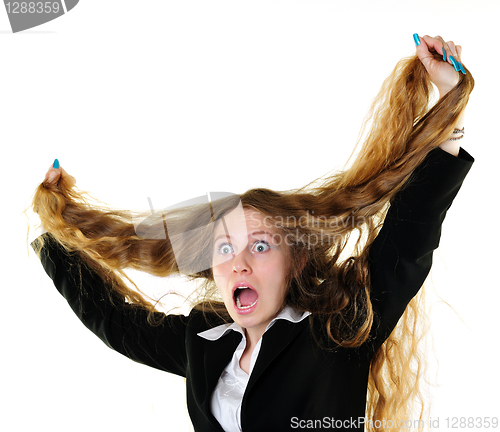 Image of Businesswoman tearing her hair
