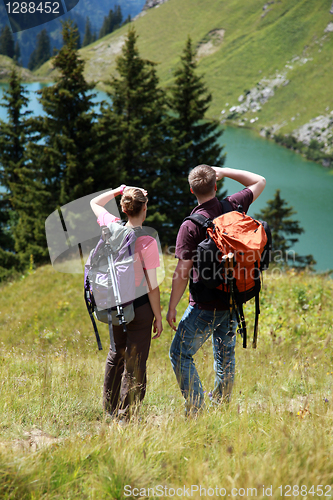 Image of Young people hiking in the mountains