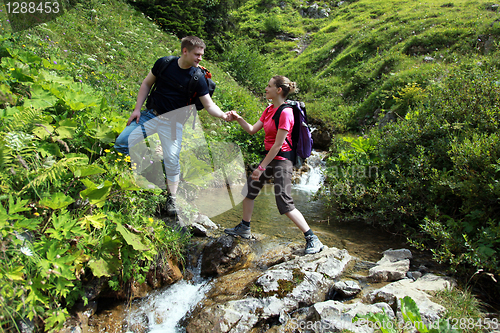 Image of Couple hiking in mountains