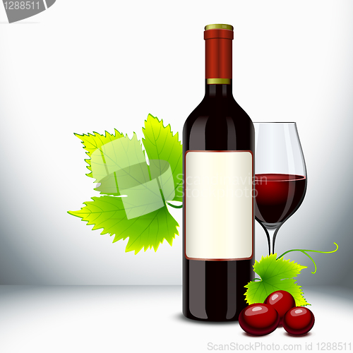 Image of Red wine glass and bottle