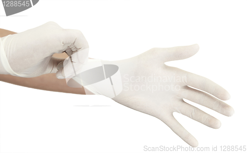 Image of Pulling on surgical glove