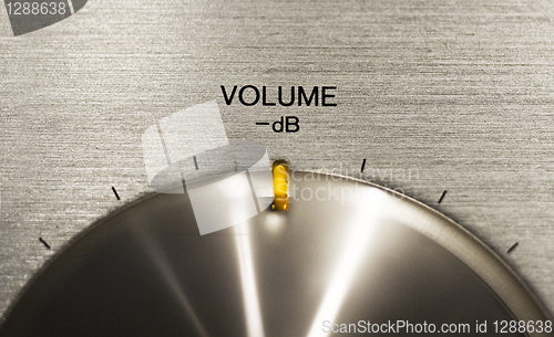 Image of volume push button on a hi-fi 