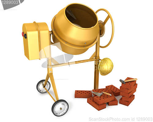 Image of Clean new yellow concrete mixer with helmet, trowel and few bric