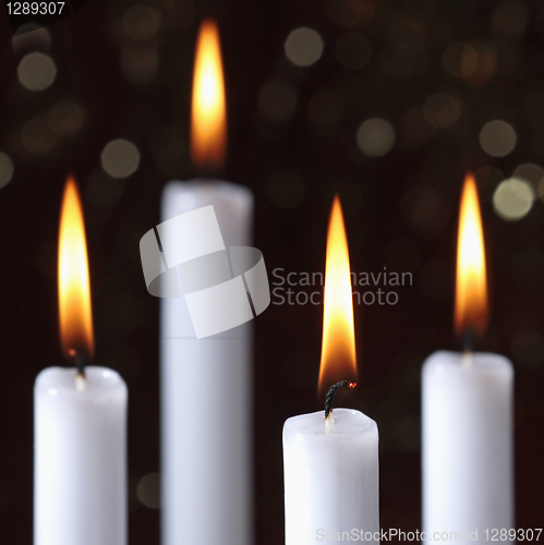 Image of four burning candles