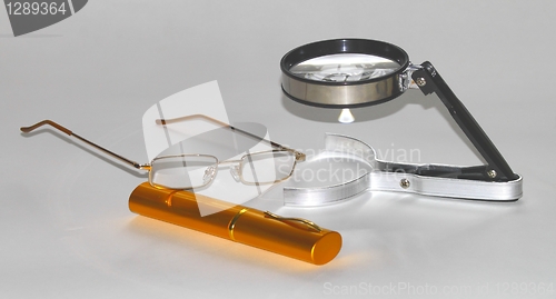 Image of magnifying glasses with cases for glasses