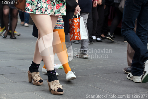 Image of Women legs in crowd
