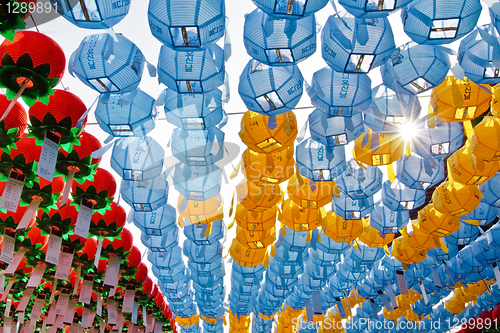 Image of Colorful lanterns with sun rays