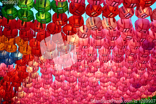 Image of Red and pink  paper lanterns in buddhist temple