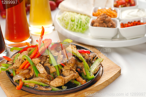 Image of original fajita sizzling hot  on iron plate