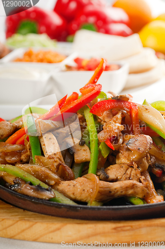 Image of original fajita sizzling hot  on iron plate