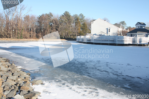 Image of Frozen river in countryside during winter time 