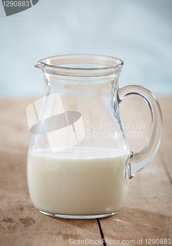 Image of closeup of milk on old wooden table