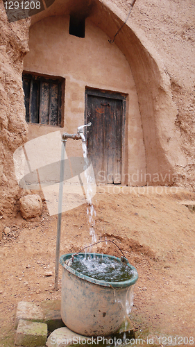 Image of Water tap and cave dwellings