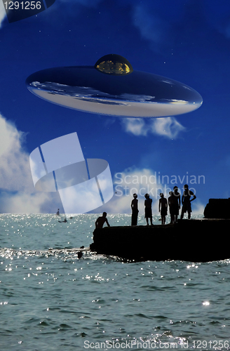 Image of UFO Over The Coast With People In Foreground