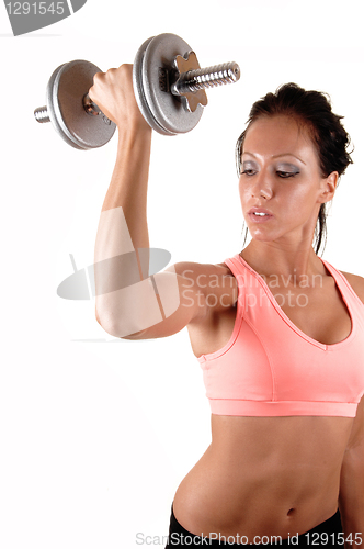Image of Girl lifting dumbbells.