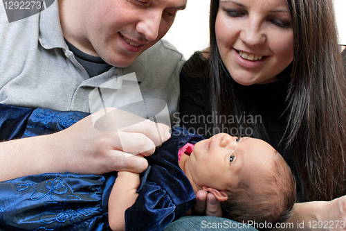 Image of Happy Parents with a Newborn Infant