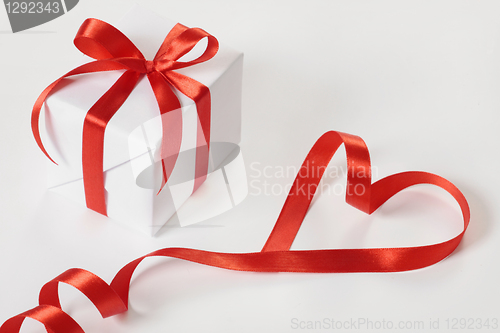 Image of gift box and red ribbon