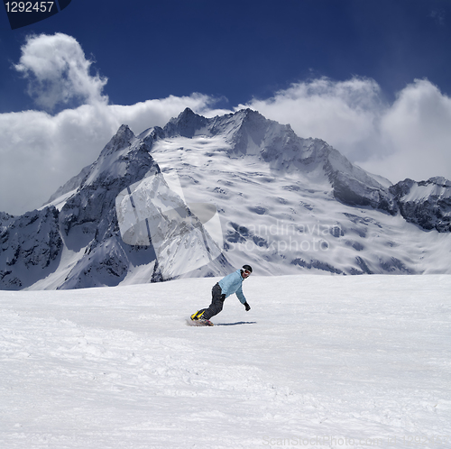Image of Snowboarder in high mountains