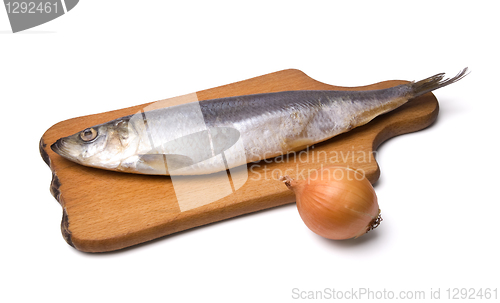Image of Herring with onion on kitchen board