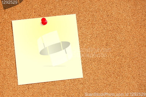Image of empty sheet paper with push pin