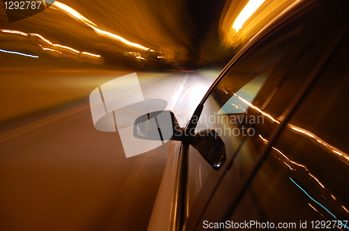 Image of night drive with car in motion 