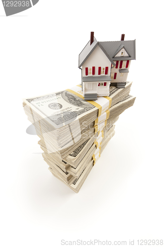 Image of Small House on Stacks of Hundred Dollar Bills