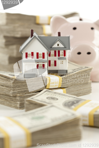 Image of Small House and Piggy Bank with Stacks Money