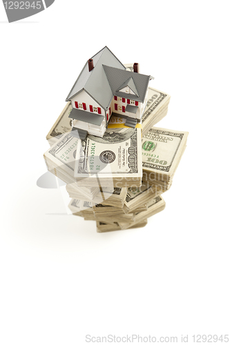 Image of Small House on Stacks of Hundred Dollar Bills