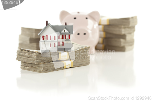 Image of Small House and Piggy Bank with Stacks Money