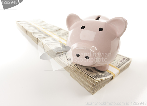 Image of Pink Piggy Bank on Row of Money