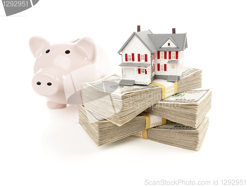 Image of Small House and Piggy Bank with Stacks Money