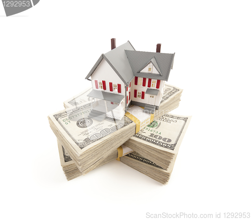 Image of Small House on Stacks of Hundred Dollar Bills