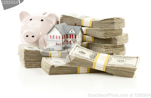 Image of Small House and Piggy Bank with Stacks Money