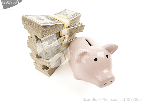 Image of Pink Piggy Bank with Stacks of Money